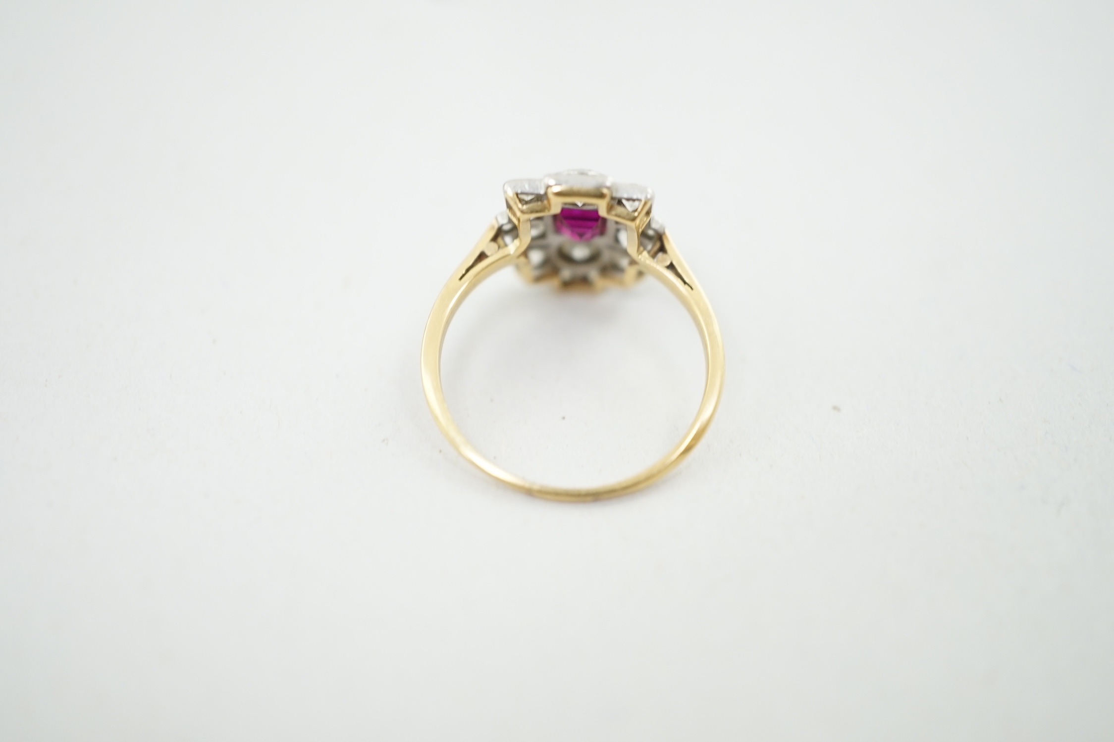 A 1920's gold and millegrain set ruby and diamond cluster dress ring